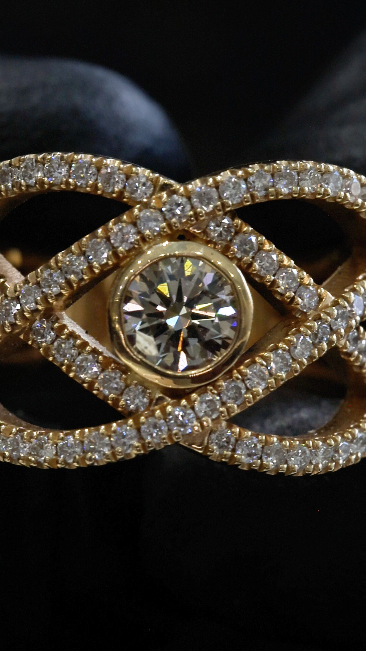 Natural Fancy Yellow Diamond Infinity Ring with Pavé Crisscross Design in Yellow Gold | Elegant Statement Style