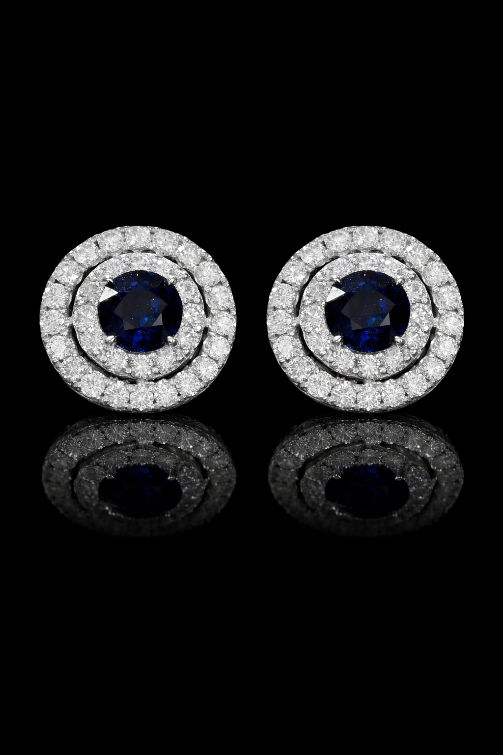 Natural round sapphire double halo stud earrings in 14K white gold with 0.65CT G-H SI diamonds – luxury Houston fine jewelry by Endless Diamonds.