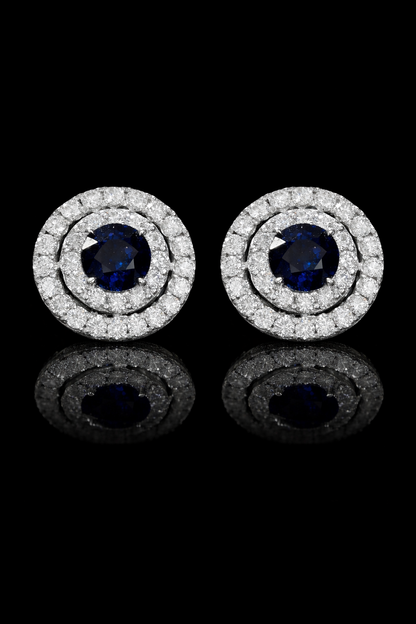 Natural round sapphire double halo stud earrings in 14K white gold with 0.65CT G-H SI diamonds – luxury Houston fine jewelry by Endless Diamonds.