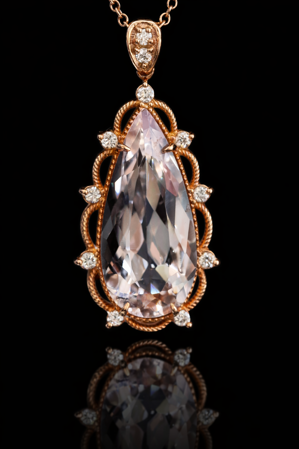 14K rose gold pear shaped morganite pendant with 5.88 carat center stone and 0.15 carat G-H SI diamond rope halo design