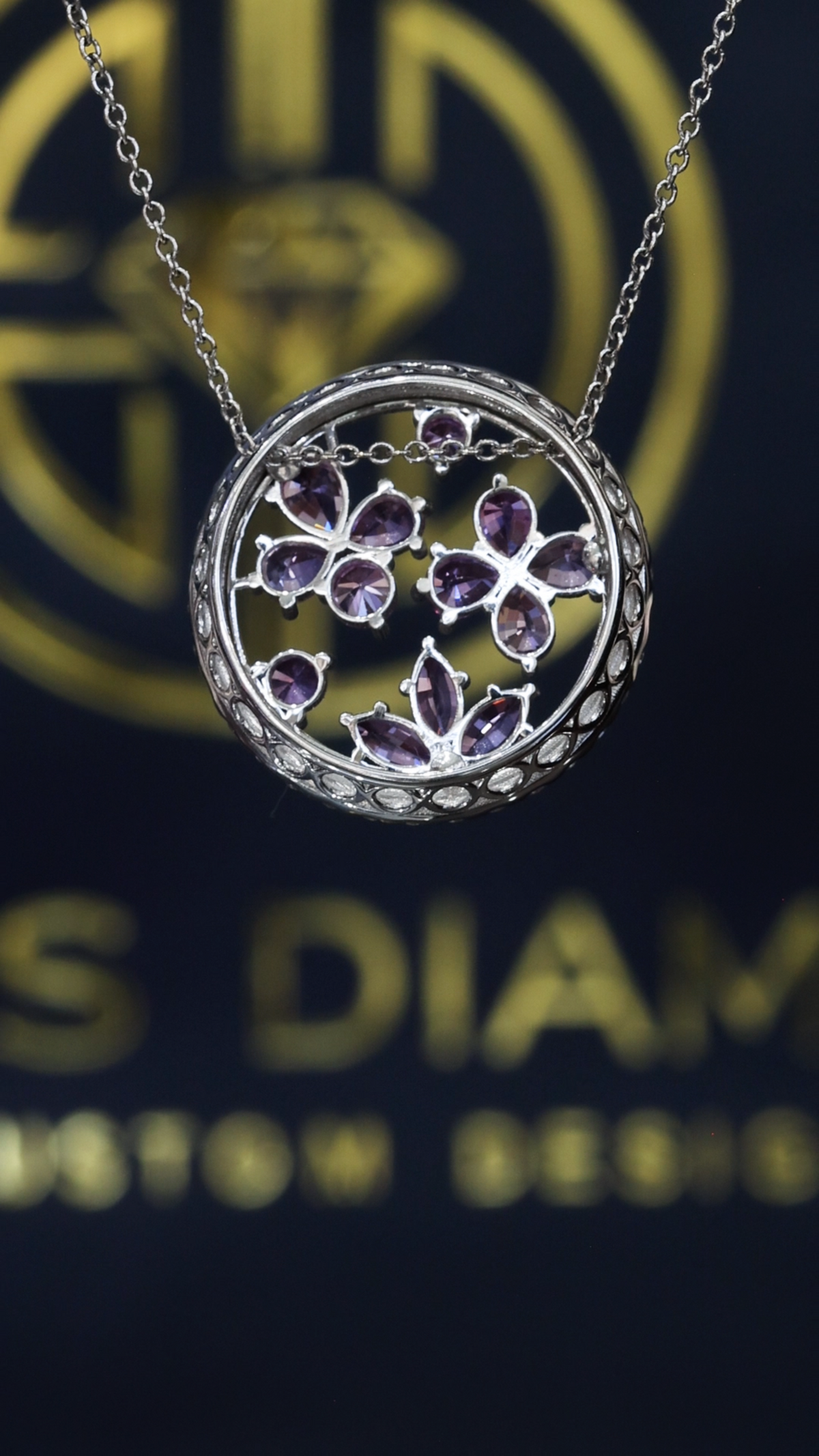 14K white gold pink sapphire floral halo pendant with 0.90 carat sapphires and 0.75 carat G-H SI diamond circle frame