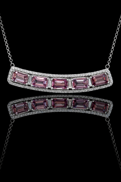 14K white gold curved pink sapphire bar necklace with 2.9 carat emerald cut sapphires and 0.5 carat diamond halo setting