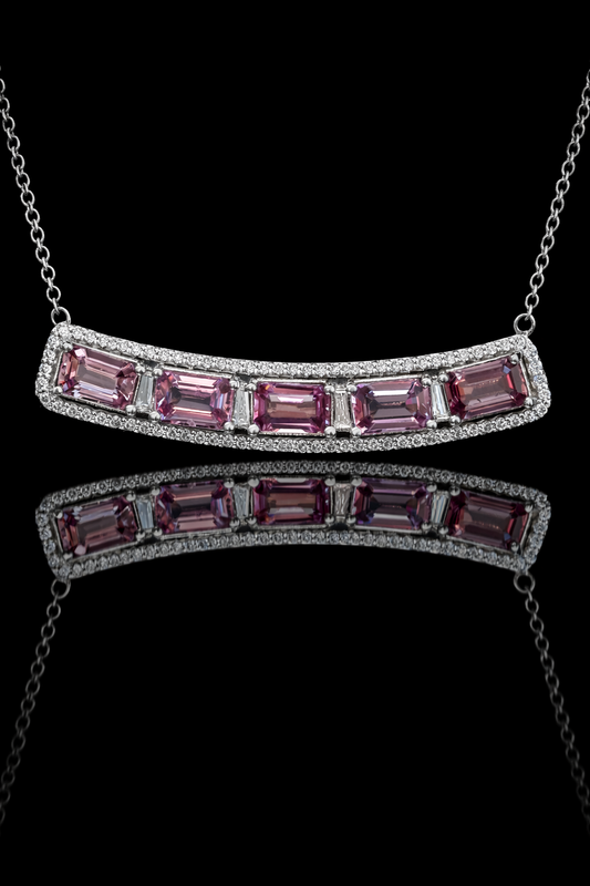 14K white gold curved pink sapphire bar necklace with 2.9 carat emerald cut sapphires and 0.5 carat diamond halo setting