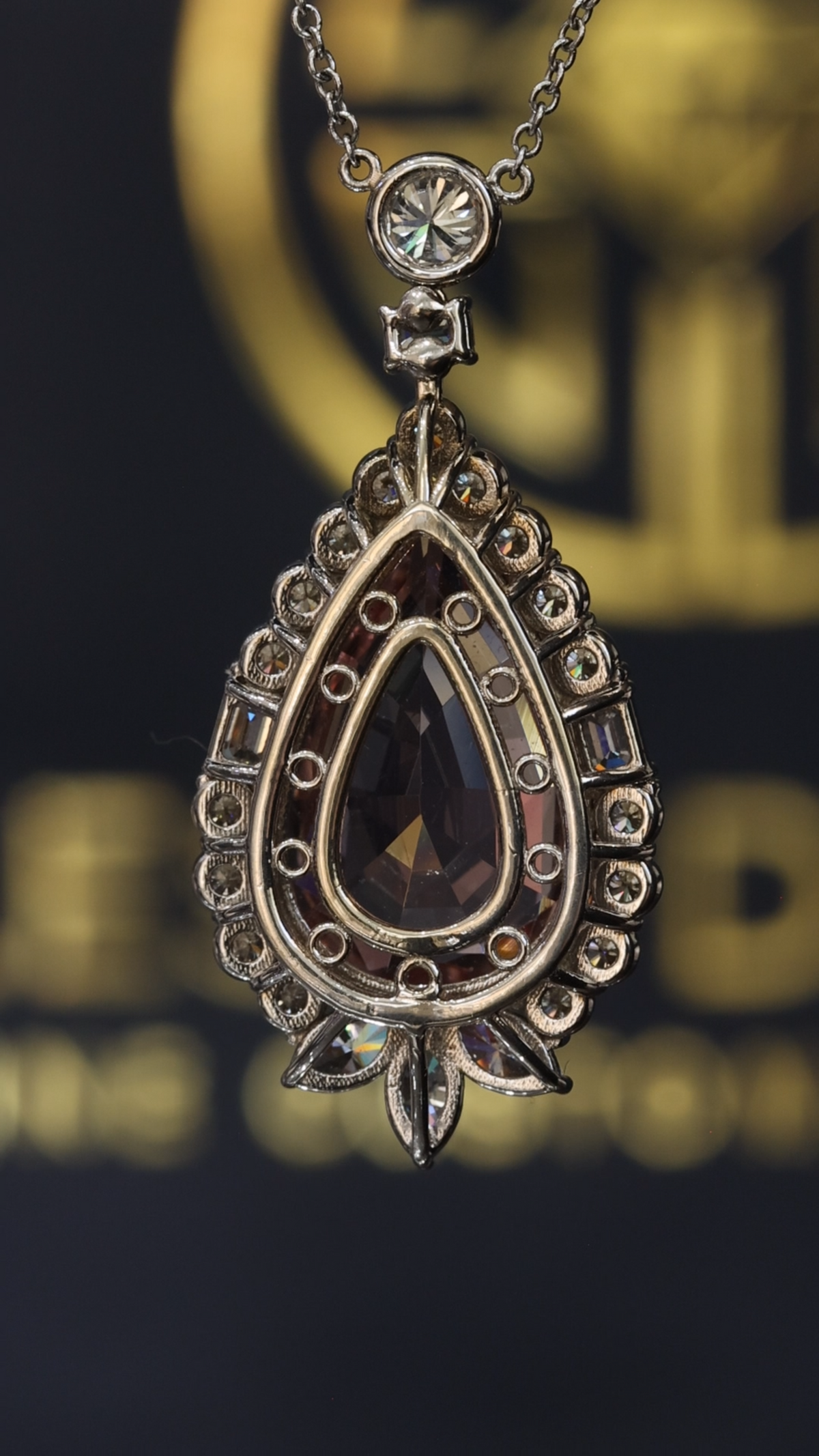 14K white gold pear shape morganite halo pendant with 6.01 carat center stone and 2.01 carat G-H SI diamond setting