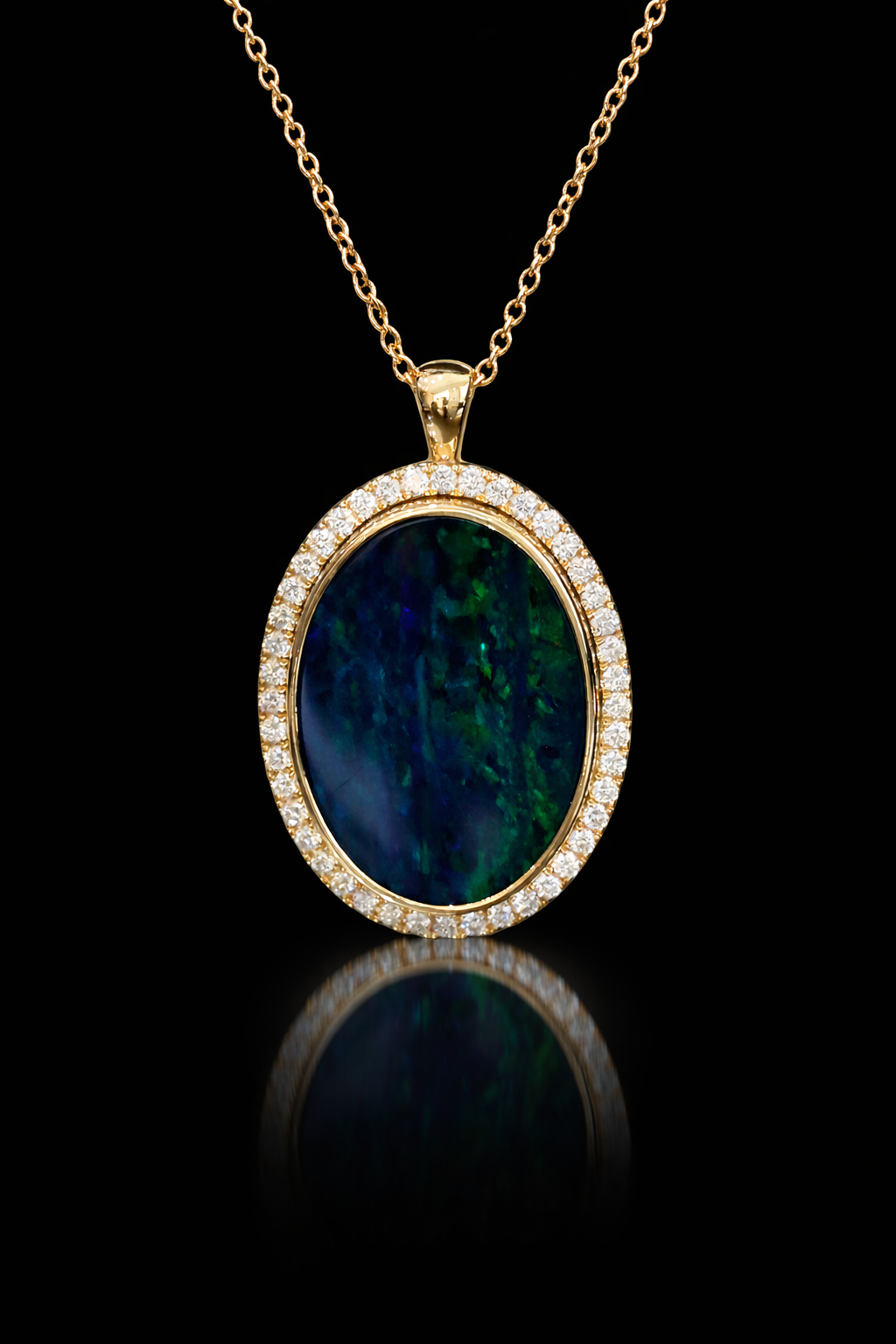 14K yellow gold oval black opal halo pendant with 0.42 carat G-H SI diamond pavé setting