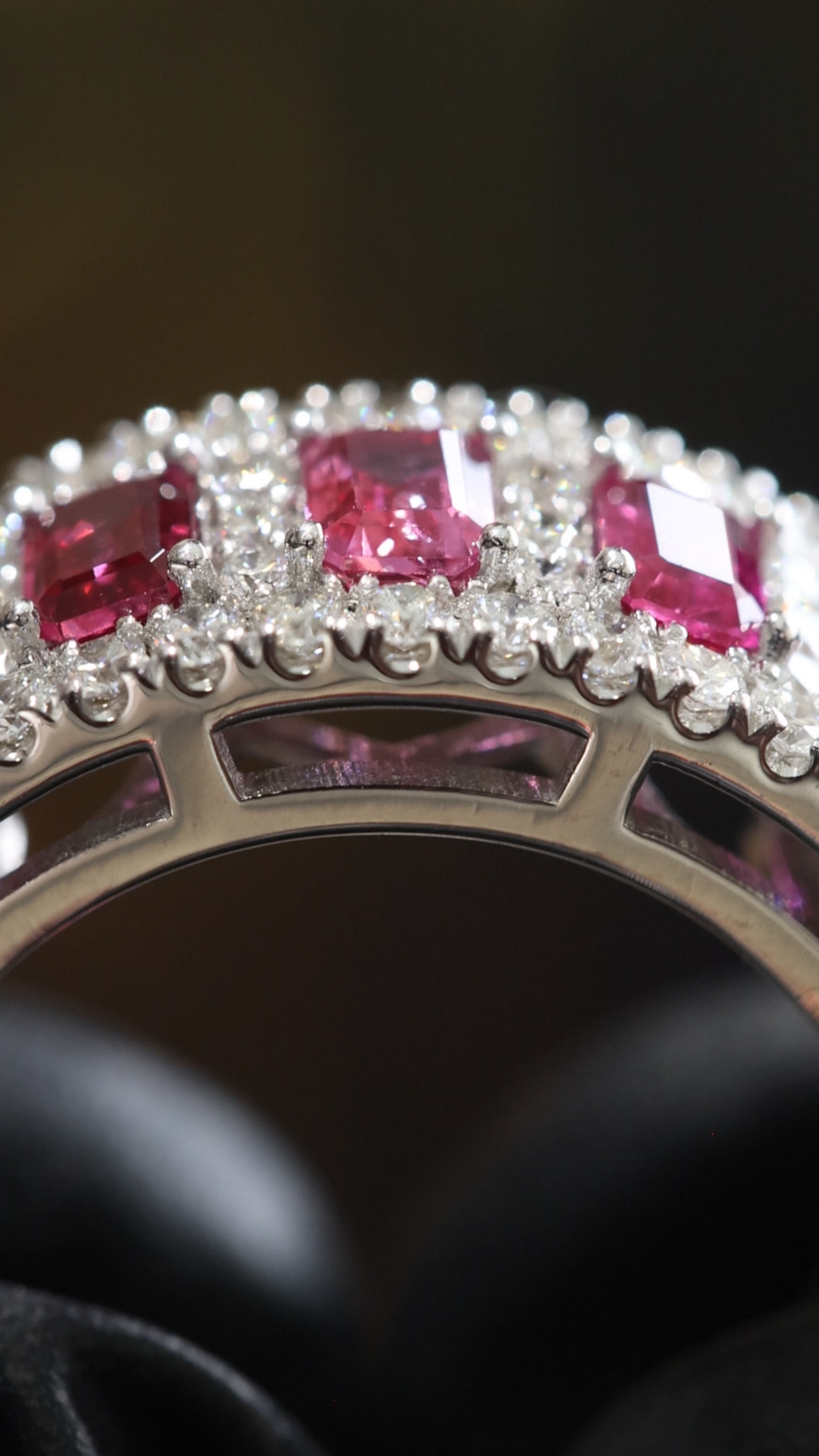 Crimson Gallery Ruby Eternity Band in White Gold | Emerald-Cut Rubies with Diamond Halo Rows
