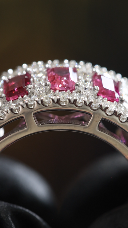 Crimson Gallery Ruby Eternity Band in White Gold | Emerald-Cut Rubies with Diamond Halo Rows