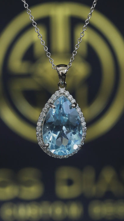 Pear shape blue topaz halo pendant in 14K white gold with 0.27 carat G-H SI diamond accents Houston jewelry store Endless Diamonds