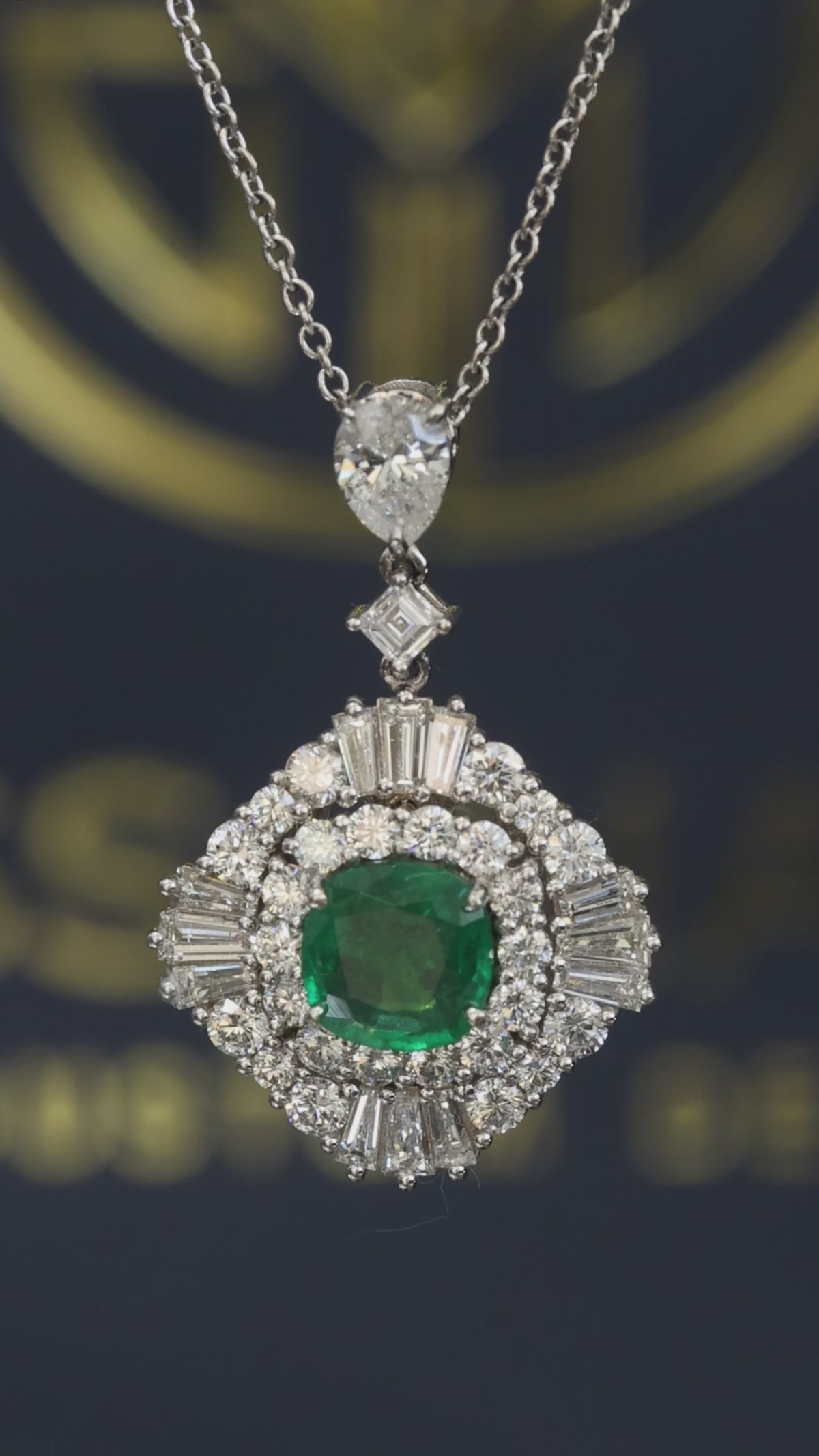 14K white gold emerald halo pendant with 1.00 carat cushion cut emerald and 2.01 carat G-H VS-SI diamond cluster setting