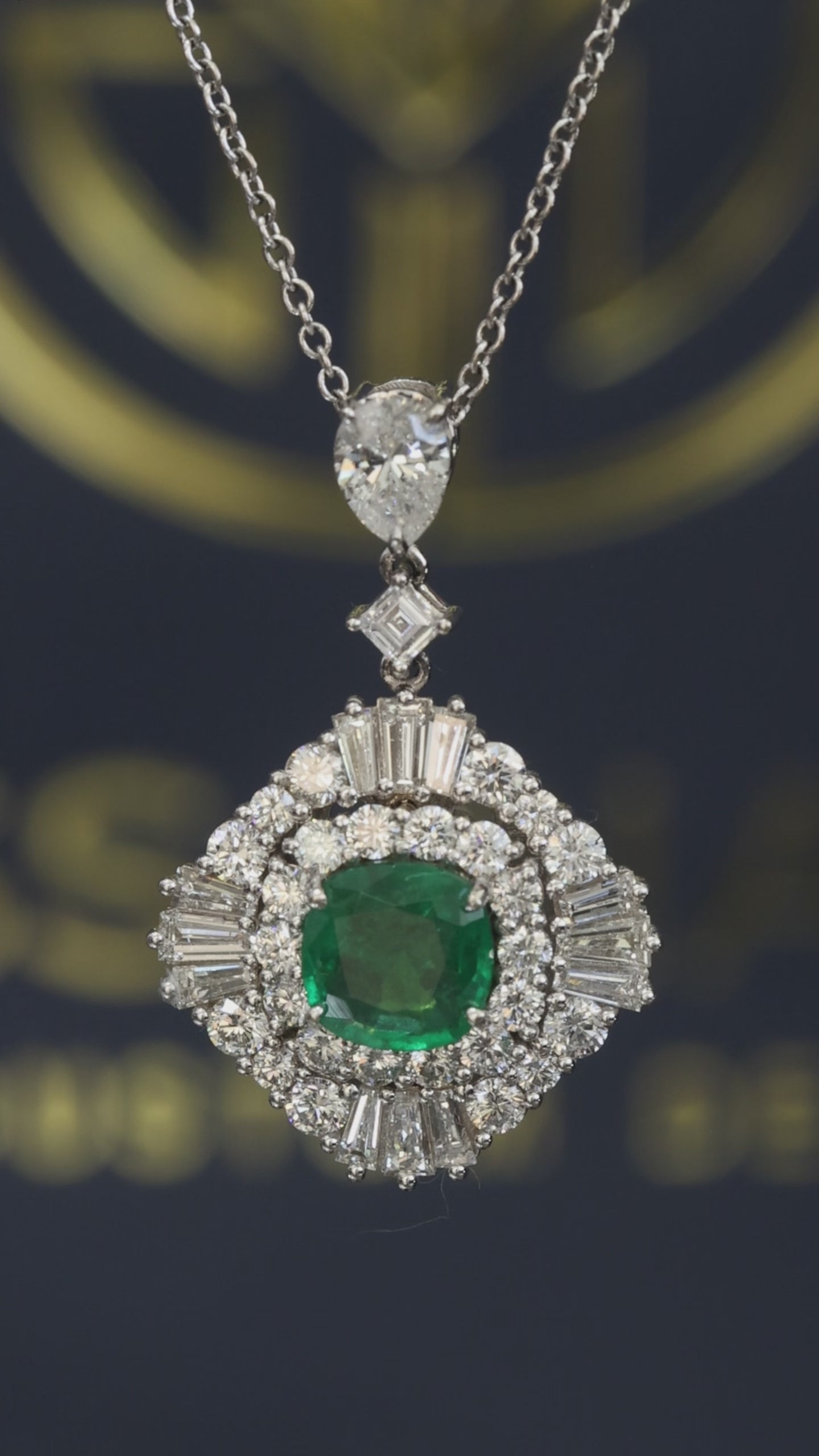 14K white gold emerald halo pendant with 1.00 carat cushion cut emerald and 2.01 carat G-H VS-SI diamond cluster setting