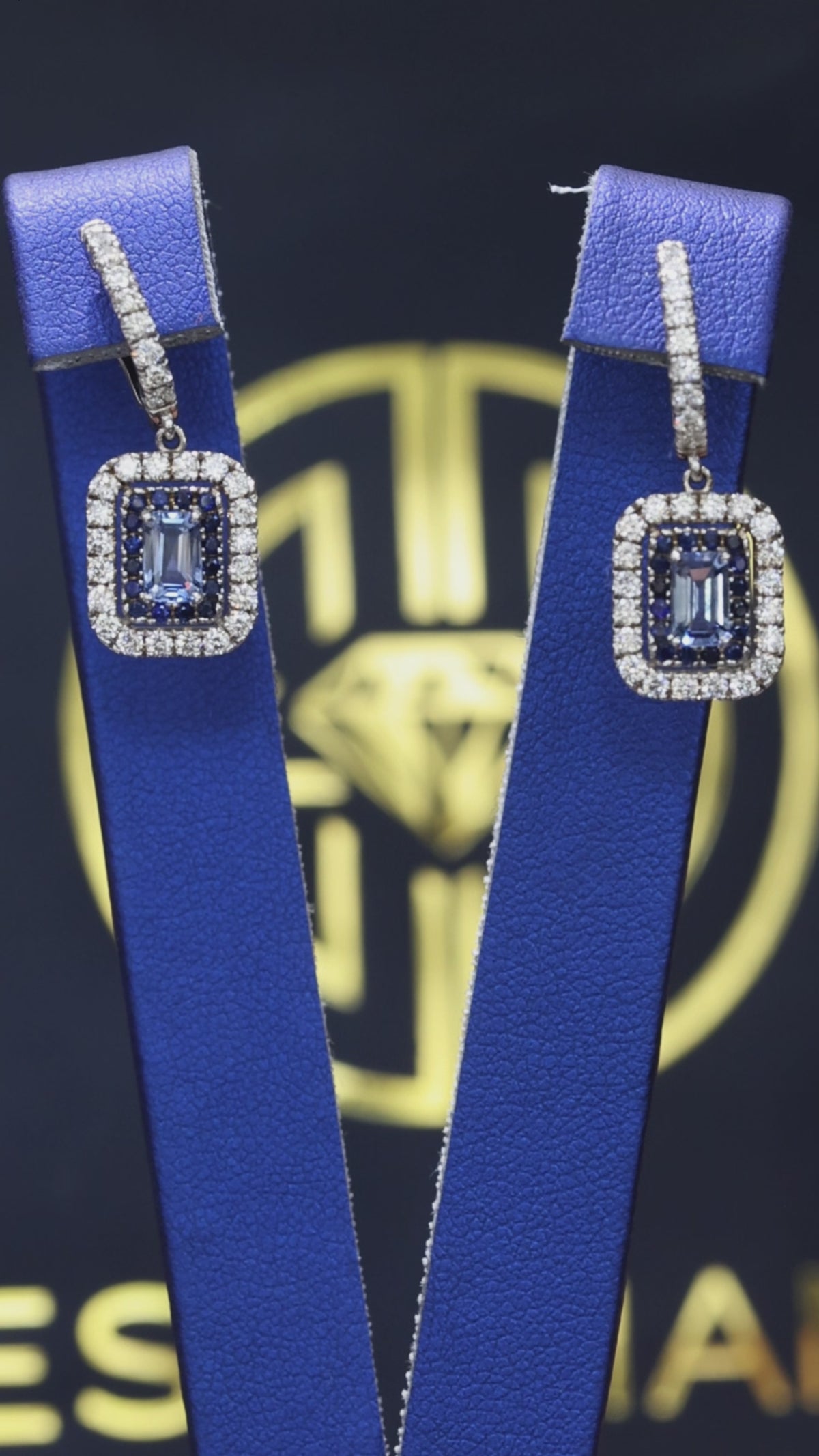 Natural emerald-cut sapphire double halo drop earrings in 14K white gold with 0.78CT G-H SI diamonds – Houston fine jewelry by Endless Diamonds.