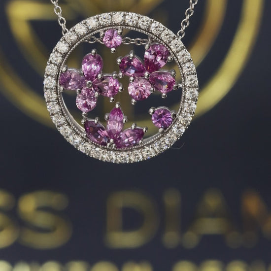 14K white gold pink sapphire floral halo pendant with 0.90 carat sapphires and 0.75 carat G-H SI diamond circle frame