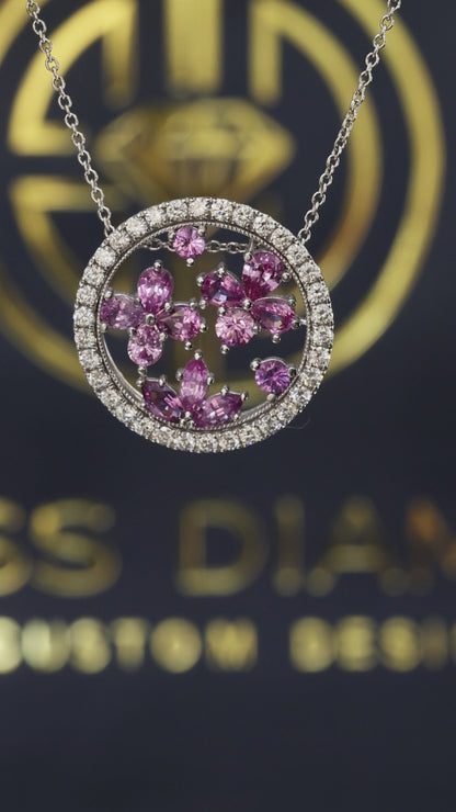 14K white gold pink sapphire floral halo pendant with 0.90 carat sapphires and 0.75 carat G-H SI diamond circle frame