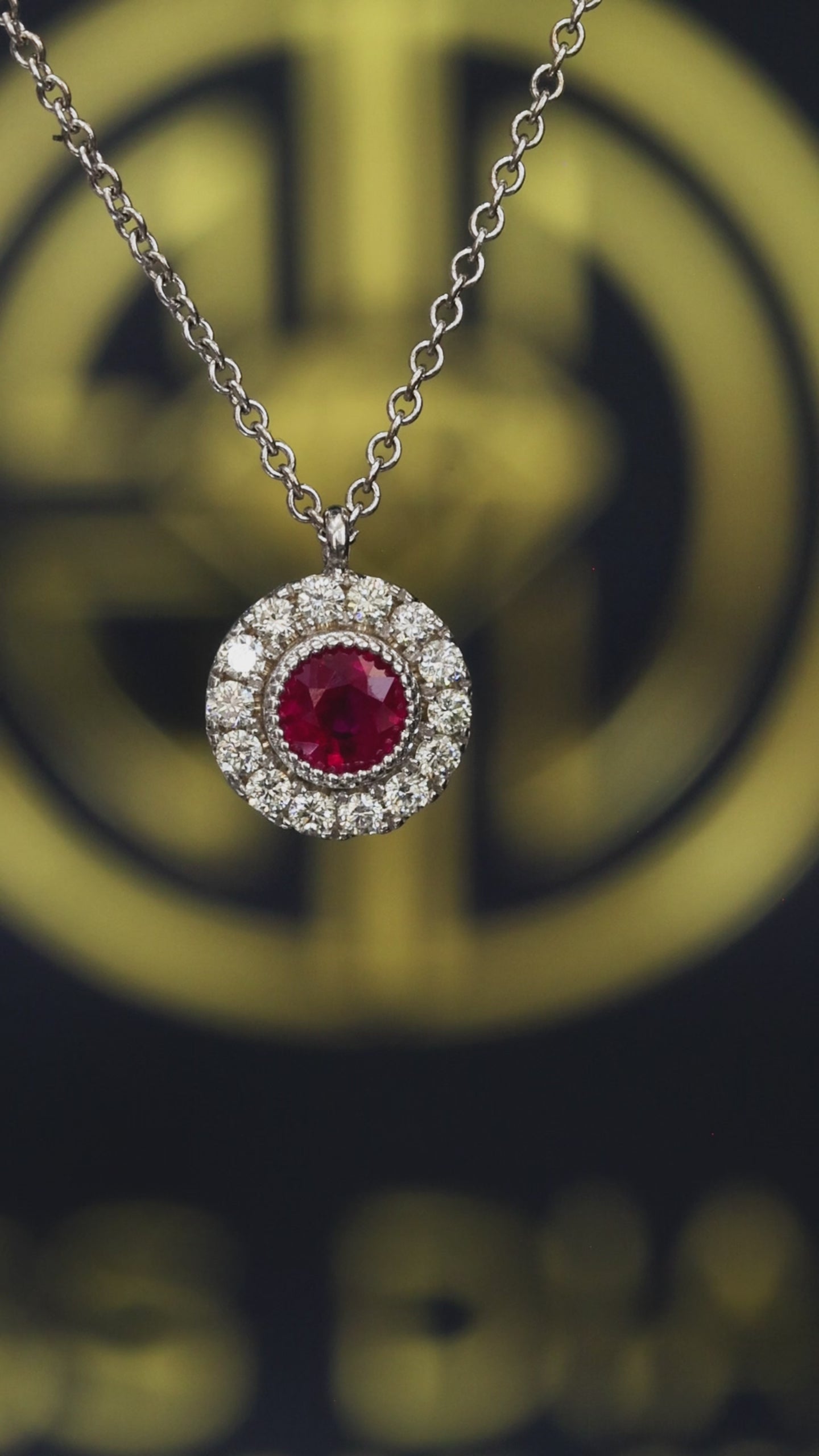 Round 0.30 carat ruby double halo pendant in 14K white gold with 0.14 carat G-H SI diamonds Houston jewelry store Endless Diamonds