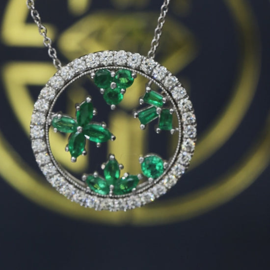 14K white gold emerald floral halo pendant with 0.88 carat emerald cluster and 0.74 carat G-H SI diamond circle frame