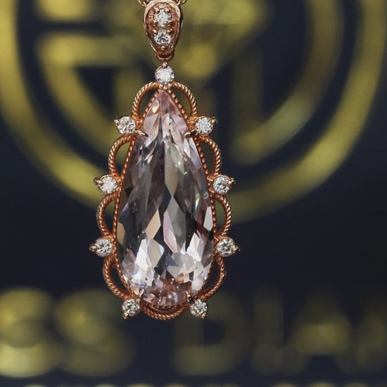 14K rose gold pear shaped morganite pendant with 5.88 carat center stone and 0.15 carat G-H SI diamond rope halo design
