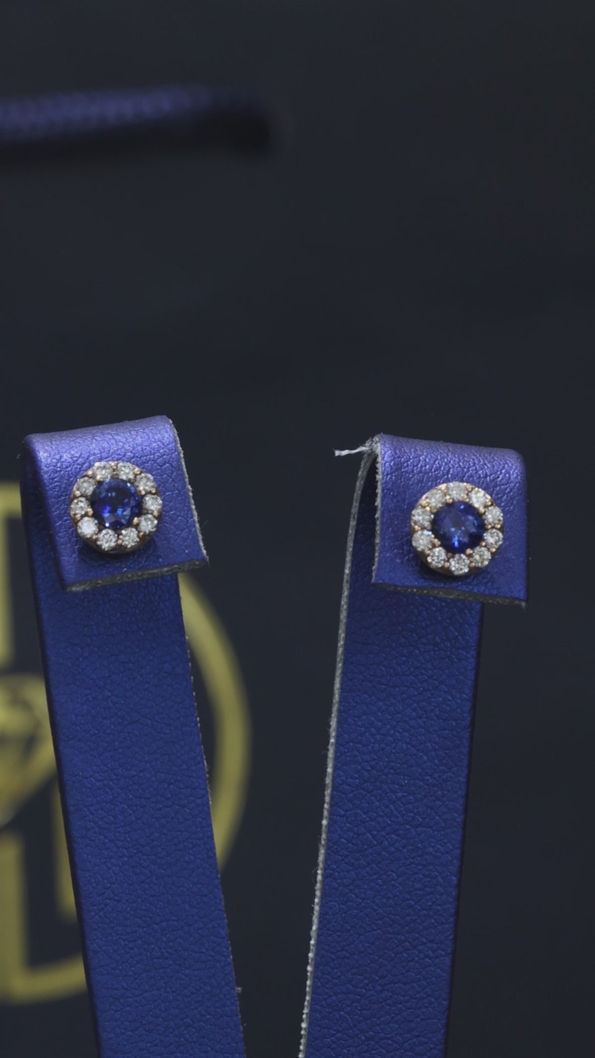 Natural round sapphire diamond halo stud earrings in 14K yellow gold with 0.20CT G-H SI diamonds – fine Houston jewelry by Endless Diamonds.