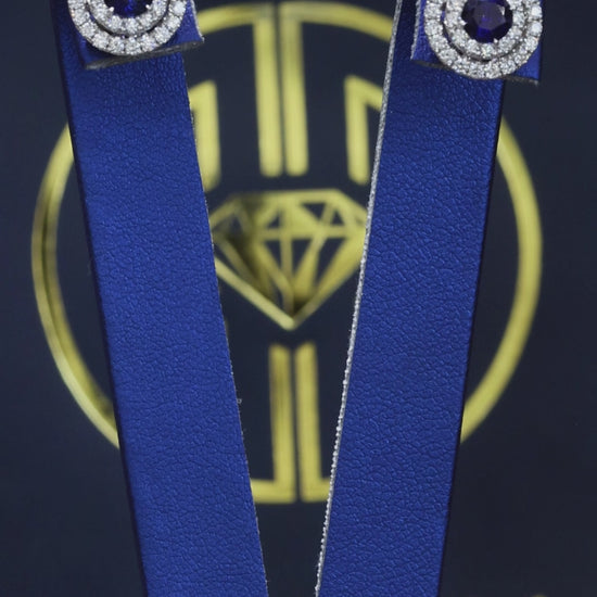 Natural round sapphire double halo stud earrings in 14K white gold with 0.65CT G-H SI diamonds – luxury Houston fine jewelry by Endless Diamonds.