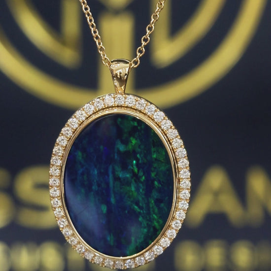 14K yellow gold oval black opal halo pendant with 0.42 carat G-H SI diamond pavé setting