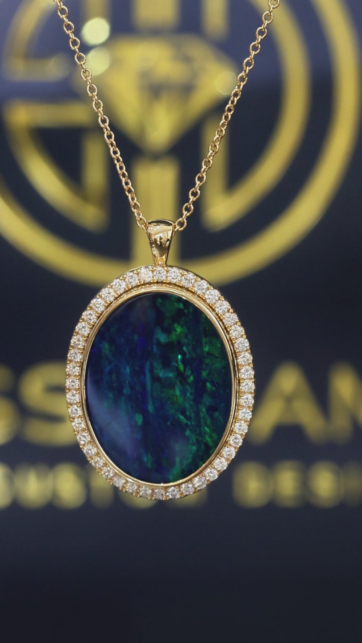 14K yellow gold oval black opal halo pendant with 0.42 carat G-H SI diamond pavé setting