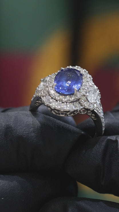 Oval Blue Sapphire Double Halo Ring with Diamond Accents | 4.41 CTW