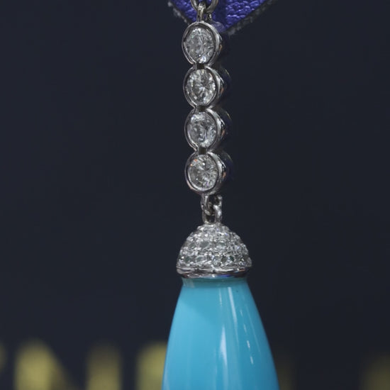 14K white gold diamond drop earrings with pear-shaped blue tourmaline gemstones and bezel-set diamond chain