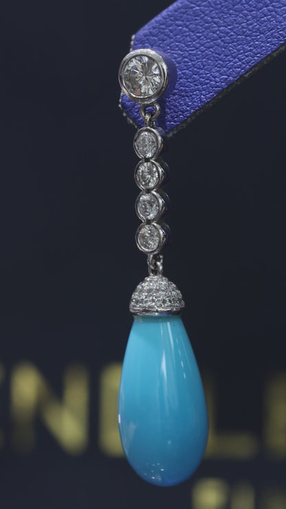 14K white gold diamond drop earrings with pear-shaped blue tourmaline gemstones and bezel-set diamond chain